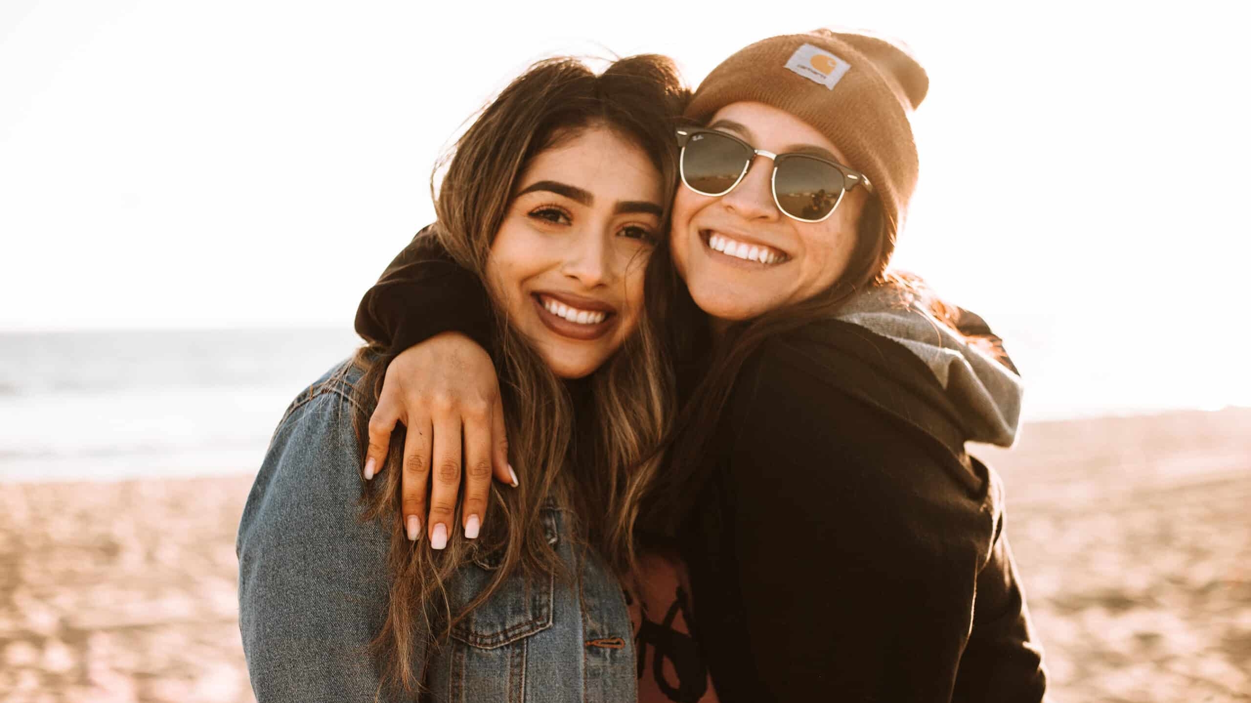 smiling hispanic women friends
